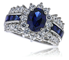 Regent 1 carat oval, round and princess cut cluster halo ring with lab grown sapphire and cubic zirconia in 14k white gold.