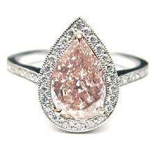 Angelika 5 Carat Simulated Pink Pear Pave Halo Solitaire with lab grown diamond simulant cubic zirconia in 14k white gold.