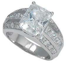 Emerald cut 4 carat channel set round and princess cut lab grown diamond simulant cubic zirconia engagement ring in 14k white gold.