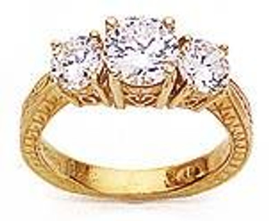 Vintage 1 carat round center lab grown diamond quality cubic zirconia engraved three stone ring in 14k yellow gold.