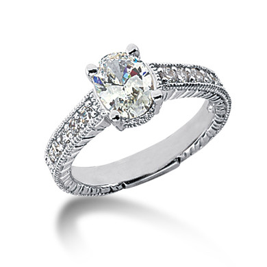 Claudine 1 carat oval lab created cubic zirconia pave engraved solitaire engagement ring in 14k white gold.