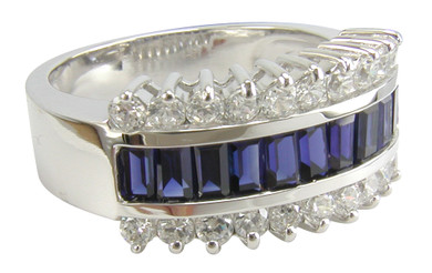 Jazz channel set man made sapphire baguette and round laboratory created diamond alternative cubic zirconia anniversary band in 14k white gold.