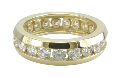 Unisex channel set lab created cubic zirconia round eternity wedding band in solid 14k gold.
