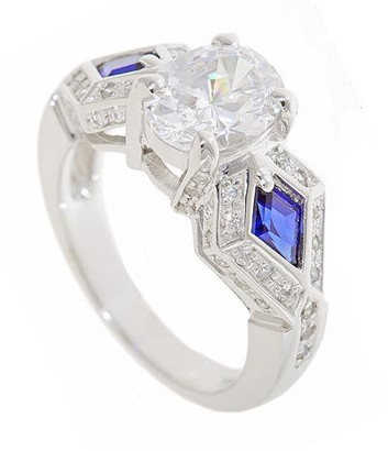 Kittera 1.5 carat oval center laboratory grown diamond alternative cubic zirconia ring with man made sapphire kite cut stones in 14k white gold.