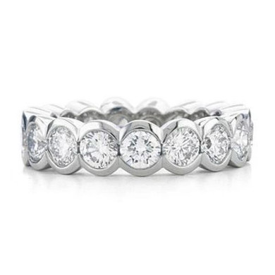 Semi bezel set round lab created cubic zirconia eternity band in 14k white gold, 14k yellow gold and platinum.