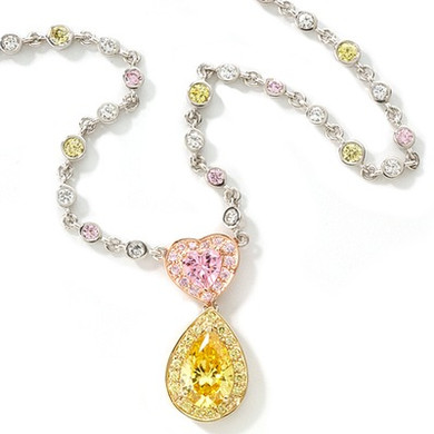 Lianna 1 Carat Heart 3 Carat Pear Halo Drop Necklace with lab grown diamond look cubic zirconia in 14k gold.
