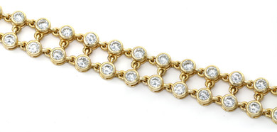 Double Link Bezel Set Round Bracelet with laboratory grown diamond alternative cubic zirconia in 14k yellow gold.