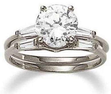 Round laboratory grown diamond look cubic zirconia baguette solitaire with matching wedding band in 14k white gold.