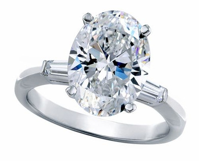 Oval lab grown diamond simulant cubic zirconia baguette solitaire engagement ring in 14k white gold.