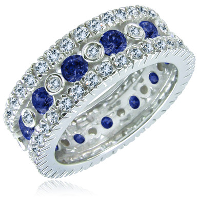 Round bezel, prong and pave set lab grown diamond simulant cubic zirconia eternity band in 14k white gold with lab created synthetic blue sapphires.