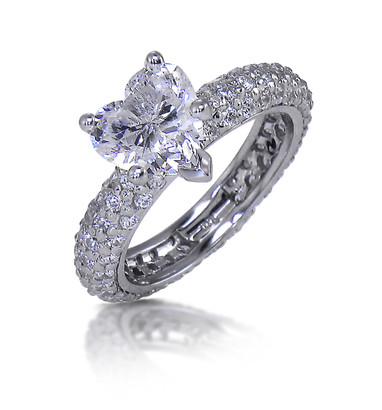 Heart shaped 2 carat lab grown diamond look cubic zirconia micro pave eternity band solitaire engagement ring in 14k white gold.