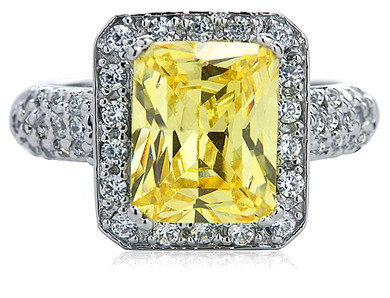 Montgomery 4 carat canary emerald cut lab created cubic zirconia halo ring with micro pave in 14k white gold.