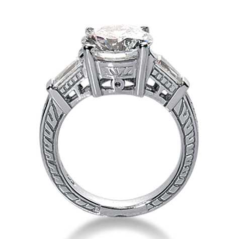 Antique estate style engraved 1.5 carat round and baguette lab created cubic zirconia engagement ring in platinum.