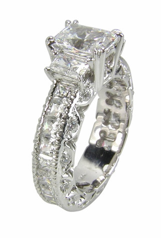 Three stone emerald radiant lab grown diamond look cubic zirconia eternity ring with channel set princess cuts in 14k white gold.