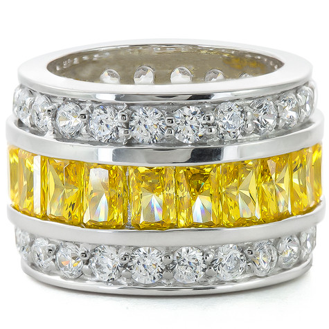 Chiffone channel set canary emerald cut and pave lab grown diamond quality cubic zirconia eternity band in 14k white gold.