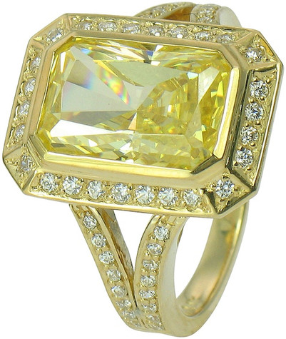 Emerald radiant cut canary lab grown diamond simulant cubic zirconia pave halo ring with a split shank in 14k yellow gold.