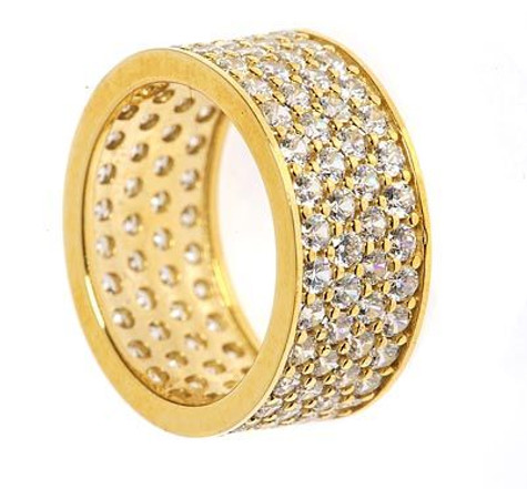 Pave set round four row laboratory grown diamond simulant cubic zirconia eternity band in 14k gold.