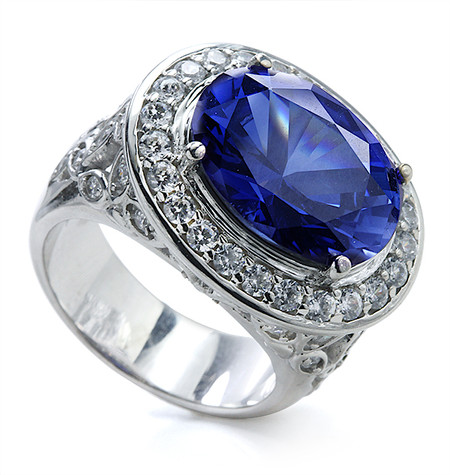 Zabel 9 carat man made sapphire oval gemstone and pave halo lab grown diamond simulant cubic zirconia cocktail ring in 14k white gold.