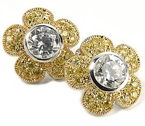 Flower styled earrings with a 2.5 carat bezel set and pave round lab grown diamond look cubic zirconia in 14k two tone gold.