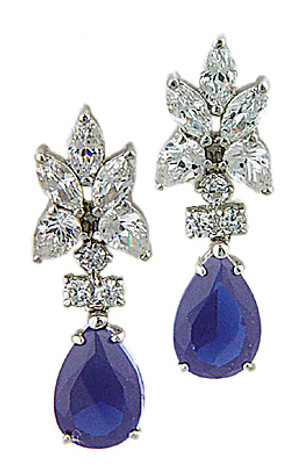 Pear cluster earrings with a 5 carat man made sapphire pear drop in 14k white gold.