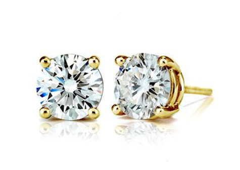 Round 1.25 carat each 7mm lab grown diamond alternative cubic zirconia stud earrings in 14k yellow gold.