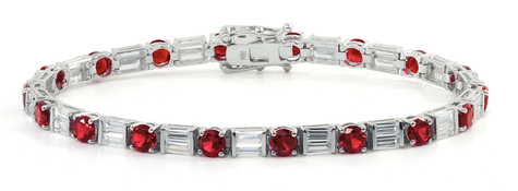 Alternating lab grown diamond simulant cubic zirconia double baguette and man made ruby rounds bracelet in 14k white gold.