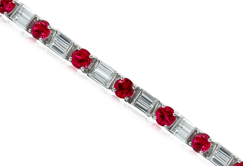 Alternating lab grown diamond quality cubic zirconia double baguette and man made ruby rounds bracelet in 14k white gold.