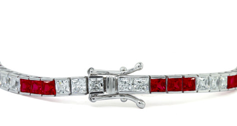 Channel Set Princess Cut Tennis Bracelet with alternating man made ruby gemstones and lab grown diamond simulant cubic zirconia in 14k white gold.