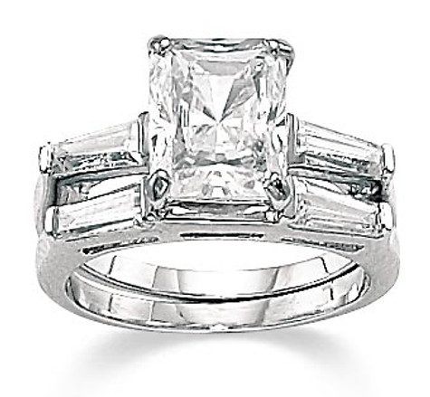 Emerald cut lab grown diamond look cubic zirconia baguette solitaire engagement ring with matching wedding band in 14k white gold.