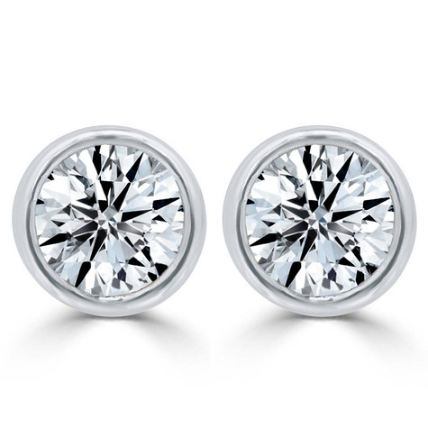 Round bezel set man made lab grown diamond look cubic zirconia stud earrings in 14k white gold with friction posts and tension backs.