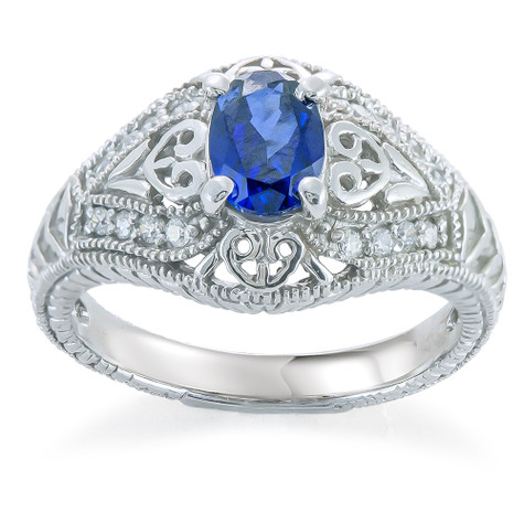 Millbrook .75 carat oval man made blue sapphire estate style ring with lab grown diamond alternative cubic zirconia in 14k white gold.