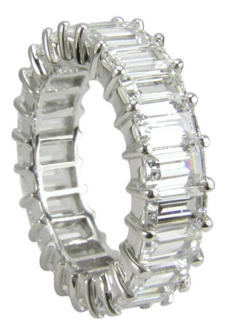 Emerald step cut prong set lab grown diamond lookcubic zirconia eternity band in 14k white gold.