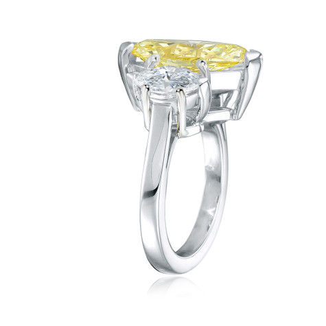 Marquiatta three stone marquise lab grown fancy canary yellow diamond look cubic zirconia engagement ring in platinum.