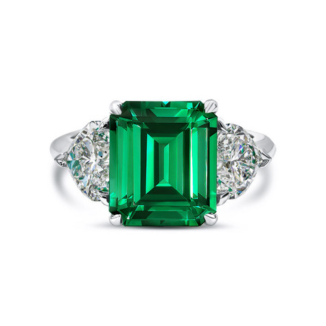 Emerald step cut lab grown diamond alternative cubic zirconia 7 carat with hearts three stone engagement ring in 14k white gold.