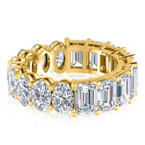 Alternity .50 carat oval and emerald step cut lab grown diamond alternative cubic zirconia eternity band in 14k yellow gold.
