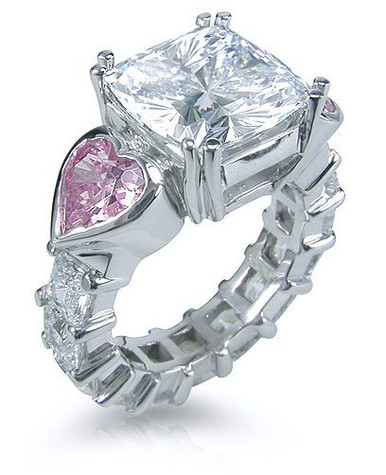 Cushion cut 5.5 carat split prong solitaire with pink heart and princess lab grown diamond simulant cubic zirconia in 14k white gold.
