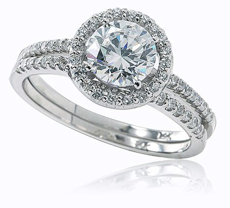 Tori 1 carat round diamond simulant cubic zirconia micro pave set halo solitaire wedding set in 14k white gold.