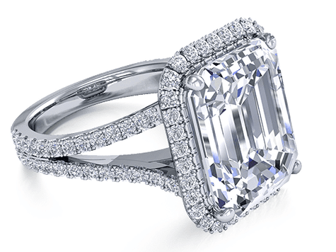 Emerald step cut 7 carat micro pave lab created cubic zirconia halo split shank engagement ring in platinum.
