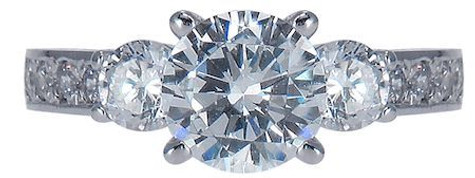 Round 1.25 carat lab grown diamond simulant cubic zirconia three stone engraved antique engagement ring in platinum.