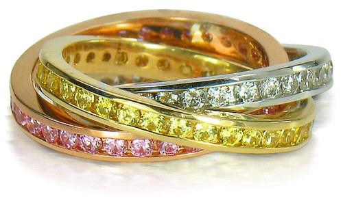 Rolling ring, trinity ring and Russian wedding rings with channel set round lab grown diamond quality cubic zirconia in 14k tri-color gold.