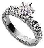 Verage 1 carat round lab grown diamond simulant cubic zirconia engraved antique estate solitaire engagement ring in 14k white gold.