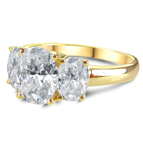 Oval 1.5 carat lab grown diamond alternative cubic zirconia three stone anniversary ring in solid 14k yellow gold.