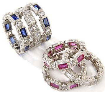 San Genero alternating round and emerald step cut lab grown diamond look cubic zirconia eternity band in 14k white gold.