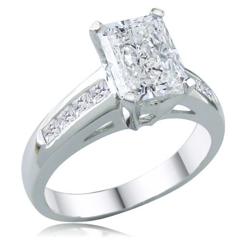 Radiant emerald cut 1.5 carat lab grown diamond look cubic zirconia solitaire engagement ring with channel set princess cuts in 14k white gold.