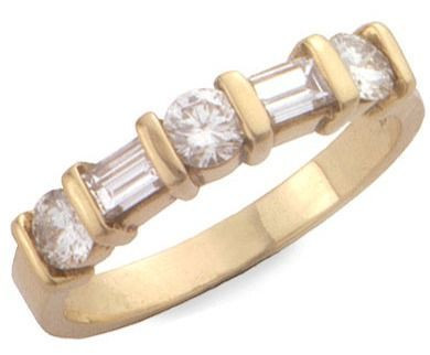 Round and double baguette lab grown diamond look cubic zirconia gemlock anniversary band in 14k yellow gold.