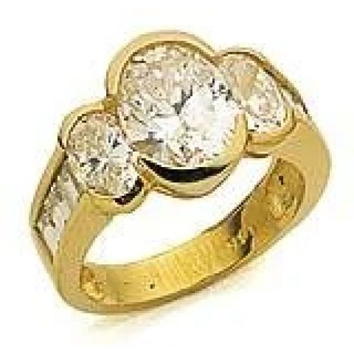 Oval Splendor 2.5 carat three stone laboratory grown diamond simulant cubic zirconia baguette engagement ring in 14k yellow gold.