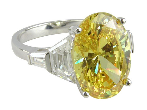 Tempio 5.5 carat oval canary laboratory grown diamond simulant cubic zirconia trapezoid baguette engagement ring in platinum.