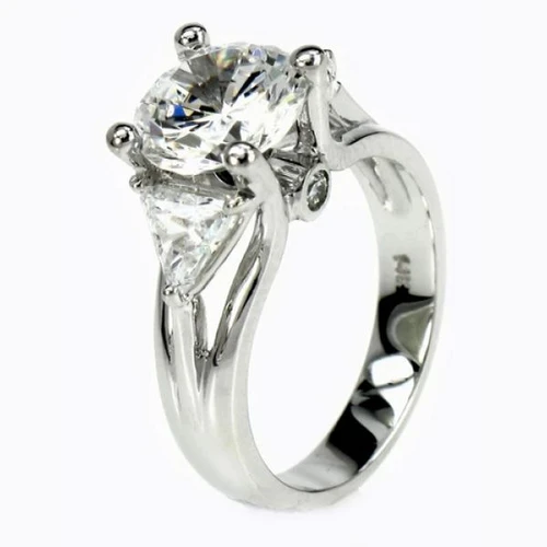 Futuristic Brilliance 2 carat round laboratory grown diamond quality cubic zirconia trillion engagement ring in platinum.