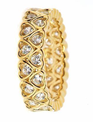 Channel set round lab grown diamond alternative cubic zirconia heart shaped eternity band in 14k yellow gold.