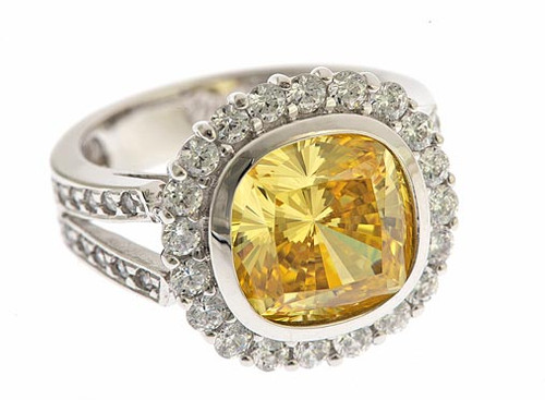 Radiant cut 7 carat cushion cut lab grown diamond alternative cubic zirconia bezel set split shank engagement ring platinum.